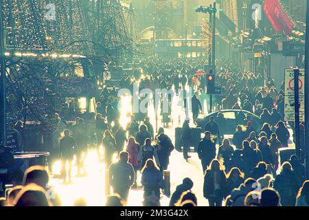 Glasgow, Scotland, UK 15th December, 2022. Christmas Shopping on the style mile of Scotland, Buchanan street. Saw shoppers enter into the festive spirit of buying stuff as the streets and shops were packed in the sunshine. Credit Gerard Ferry/Alamy Live News Stock Photo