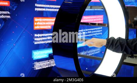 Close up of a male hand waving in front of a digital screen. Media. Modern computer screen with hand movement control Stock Photo