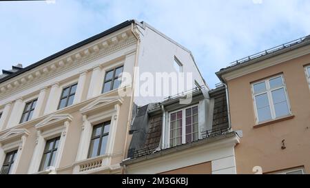 A huge beautiful hotel. Action.A huge building like a palace with large windows and white ornaments and a blue sky behind. High quality 4k footage Stock Photo