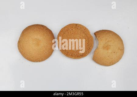 Three round biscuits half broken isolated,Cookies biscuits collection on white background. Stock Photo