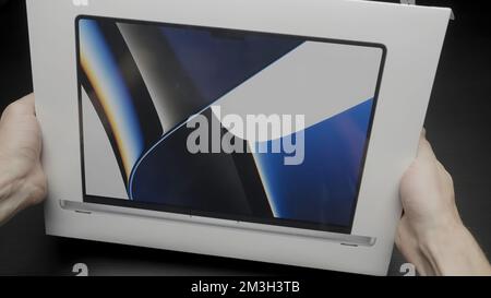 Berlin-Germany,05.07.2022, new technologies . Action.Two new small macbooks from apple that have been put up for sale. High quality FullHD footage Stock Photo