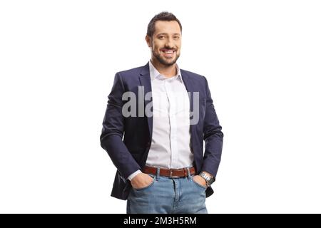 Young man in jeans and suit posing with hands in pockets and smiling isolated on white background Stock Photo