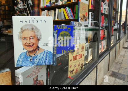 A photo story book of "Her Majesty of United Kingdom Elizabeth II" on display at bookstore window, Turin, Italy Stock Photo