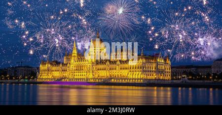 fireworks display over parliament New Year celebrations in Budapest. Night view of the Parliament in the city of Budapest in Hungary Stock Photo
