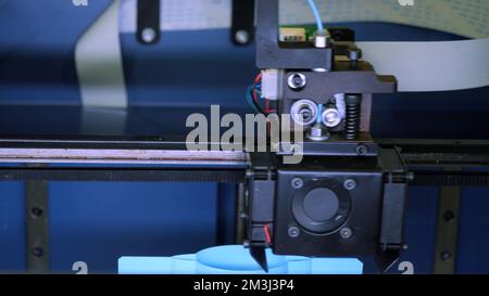 Close-up of moving machine in 3d printer. Media. Creating objects on 3D printer with machine. Process of operation of 3d printer machine during printi Stock Photo