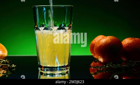 Refreshing colorful drink in a transparent glass. Stock clip. Prepared juciy cocktail at the night club party Stock Photo