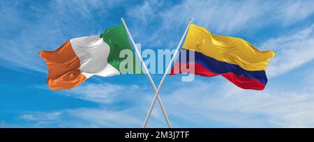 two crossed flags Colombia and Ireland waving in wind at cloudy sky. Concept of relationship, dialog, travelling between two countries. 3d illustratio Stock Photo