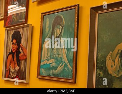 Old 1970s mass-produced paintings , in bad taste, for irony, in the Vintage Viola shop, Warrington Golden Square, England Stock Photo