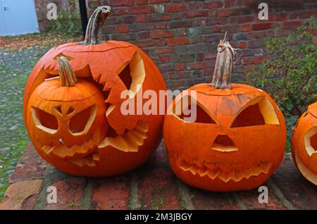 Orange Carved Halloween pumpkins, England, UK, with lights Stock Photo