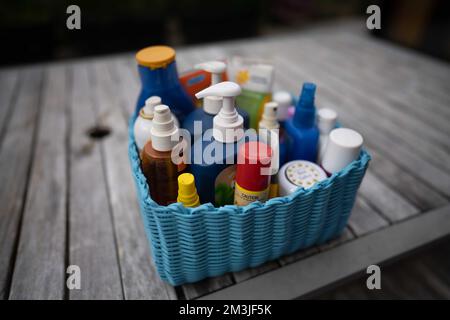 container of sunscreen, buy spray and summer lotions in summer australia in spring Stock Photo