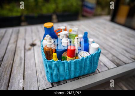 container of sunscreen, buy spray and summer lotions in summer australia in spring Stock Photo