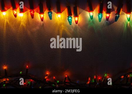 Christmas lights of different colors - Background with space for your own text Stock Photo