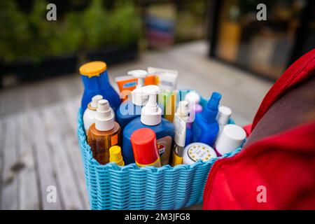 container of sunscreen, buy spray and summer lotions in summer australia in spring Stock Photo