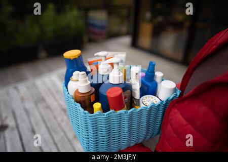 container of sunscreen, buy spray and summer lotions in summer australia in spring Stock Photo