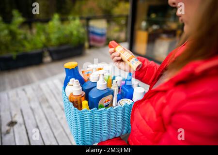 container of sunscreen, buy spray and summer lotions in summer australia in spring Stock Photo