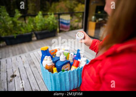 container of sunscreen, buy spray and summer lotions in summer australia in spring Stock Photo