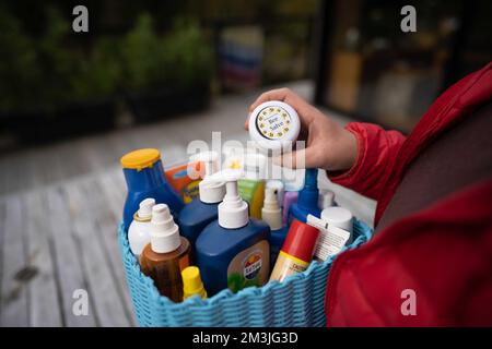 container of sunscreen, buy spray and summer lotions in summer australia in spring Stock Photo