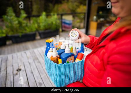 container of sunscreen, buy spray and summer lotions in summer australia in spring Stock Photo