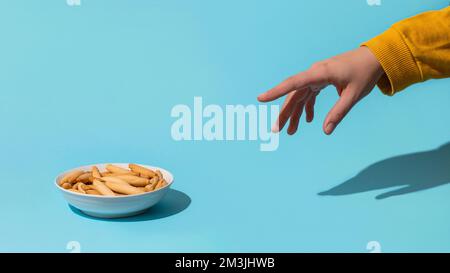 Womans hand take mini picos Stock Photo