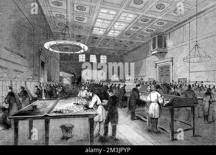 The inland letter office of the General Post Office, London showing male workers weighing, stamping and sorting letters.  1844 Stock Photo