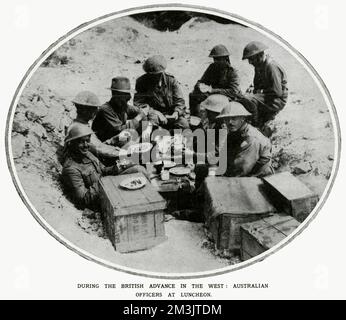 Group of Australian soldiers stopping for lunch during the British advance at the Western Front, probably the Battle of the Somme which occurred in July 1916.     Date: 1916 Stock Photo