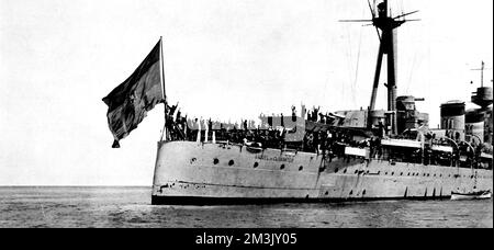 Photograph showing the stern of the Republican cruiser 'Miguel de Cervantes', with the crew giving the Socialist clenched-fist salute, 1936.      At the start of the Spanish Civil War, the majority of the Spanish Navy ships remained loyal to the Republican government, but many of the crews had to arrest their officers, who were sympathic to the Nationalist cause.     Date: 1936 Stock Photo
