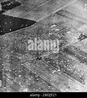 Aerial photograph showing parachutes of the Allied Airborne Army floating down to earth and discarded ones, after landing, in Holland, September 1944.  On 17th September 1944 Operation 'Market Garden' was put into action; a bold plan devised by Field-Marshal Montgomery to drop thousands of airborne troops into Holland to capture an invasion route into Germany. The British First Airborne, American 81st and 101st Divisions took part in the plan, which was ultimately unsuccessful.     Date: 1944 Stock Photo