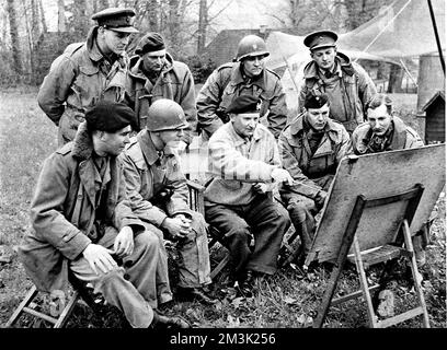 Photograph showing Field-Marshal Sir Bernard Montgomery (centre, pointing at map) briefing his liaison officers at his headquarters in Germany, April 1945.     Date: 1945 Stock Photo