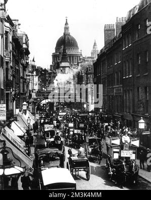 Photograph showing the view east along Fleet Street, towards Ludgate and St. Paul's Cathedral, c.1894.   A large number of horse-drawn carriages can be seen rushing along the street as a steam train heads south towards Blackfriars.     Date: c.1894 Stock Photo