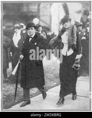 The cartoonist and caricaturist, Georges Goursat, otherwise known as 'Sem', (1863 - 1934), pictured at the races at Auteuil with Madame Roxane.  Sem was a member of the Salon des Humoristes and an officer of the Legion of Honour.  His caricatures are a revealing glimpse into Parisian society around the turn of the last century.     Date: 1913 Stock Photo