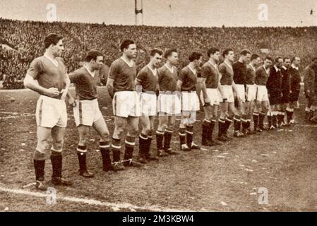 The ill-fated Manchester United team lined up before the start of their match against Red Star at Belgrade on February 5th 1958. The match was drawn 3-3. The following day, 8 of the team were killed in a plane crash at Munich.     Date: 5th February 1958 Stock Photo