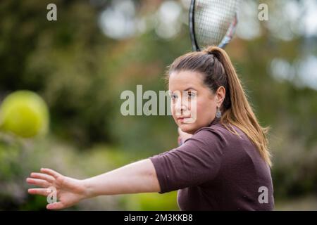 female tennis hitting tennis balls in summer in america Stock Photo