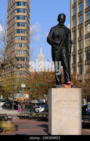 The statue of Juan Pablo Duarte 1813-1876 the founder of Dominican Republic in Duarte Square with Empire State Building in the background.Lower Manhattan.New York City.USA Stock Photo