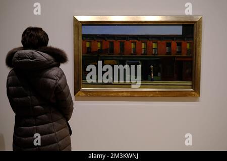 A visitors enjoying 'Early Sunday Morning' 1930 by Edward Hopper display in the exhibition of Edward Hopper's New York in Whitney Museum of American Art.Manhattan.New York City.USA Stock Photo