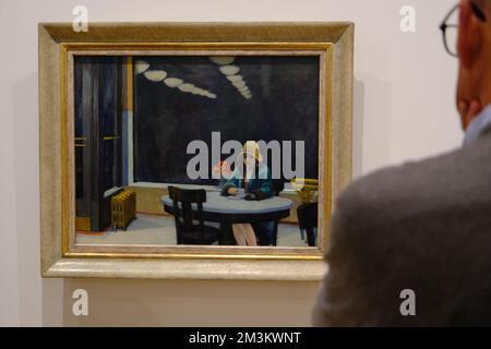 A visitor admiring Automat 1927 by Edward Hopper in the exhibition of Edward Hopper's New York in Whitney Museum of American Art.New York City.USA Stock Photo