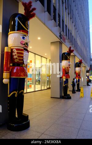 Giant Christmas toy soldiers decorating of UBS Investment banking company building on 6th Avenue during Holiday season.Manhattan.New York City.USA Stock Photo