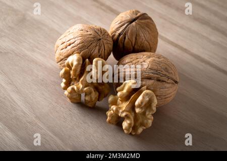 Cracked and whole walnuts together,closeup Stock Photo