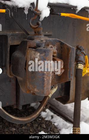 A coupler on a BNSF American Hoist & Derrick Co., Model 840 DE, 40-50 ton, Diesel-Electric Locomotive Crane, in the snow, Troy, Montana.   This model Stock Photo
