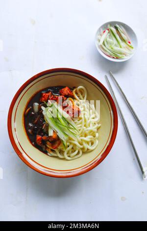 Jajangmyeon or JJajangmyeon is Korean Noodle with Black Sauce - served on table Stock Photo