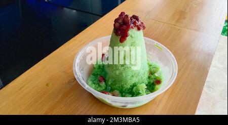 kakigori is Japanese shaved ice dessert , with red beans and sweet sauce on ice cream. Traditional summer dessert in Japan Stock Photo