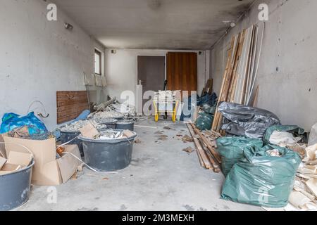 Renovation of old house, garage with rubble under construction Stock Photo