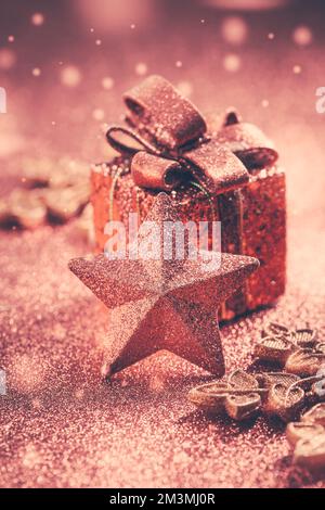 Christmas Present with ornaments and balls. Blurry glitter  background. Stock Photo