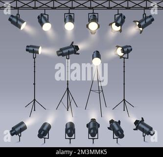 Realistic spotlights. Lamp on tripod stand, photo studio or stage light equipment. Spotlight with light beam glow effect vector set of tripod realisti Stock Vector