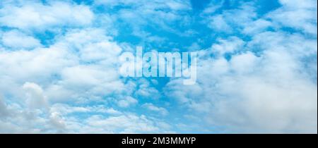 Panoramic sky with white clouds. Sky panorama. Blue cloudy sky panorama. Panoramic Blue sky and white clouds. fluffy cloud in blue haven background. h Stock Photo
