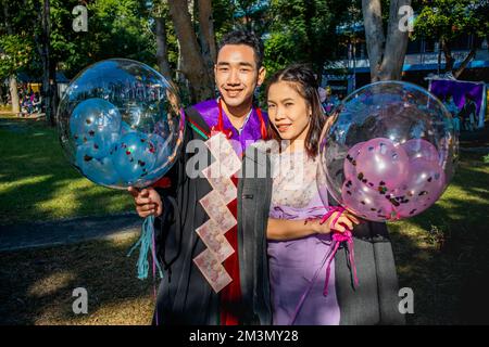 The graduate wore a gown from a university in Thailand. For graduation Stock Photo