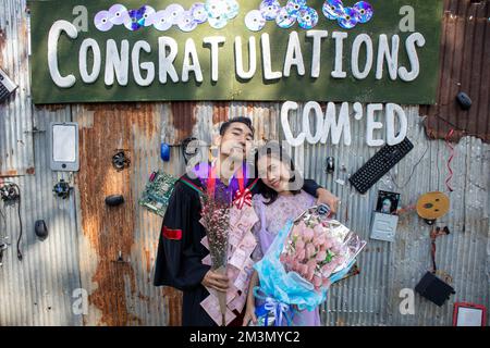 The graduate wore a gown from a university in Thailand. For graduation Stock Photo