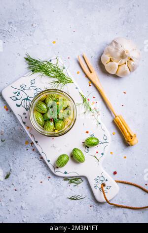Homemade food: Pickled cucamelons (pickled cucumbers, pickled gherkins), grown in a organic kitchen Stock Photo