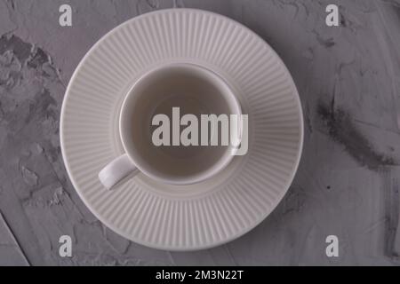 photo empty light cup with saucer top view Stock Photo