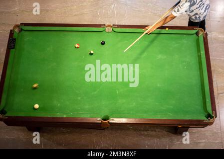 placing snooker. Cue and pool balls for pocket from top view. Stock Photo