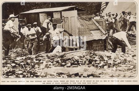 Fighting between war veterans and United States troops where at its height on 28th July, 1932. Men of the Bonus Army flinging stones and bricks at police who advance upon them, to turn them out of the camp.     Date: July 1932 Stock Photo